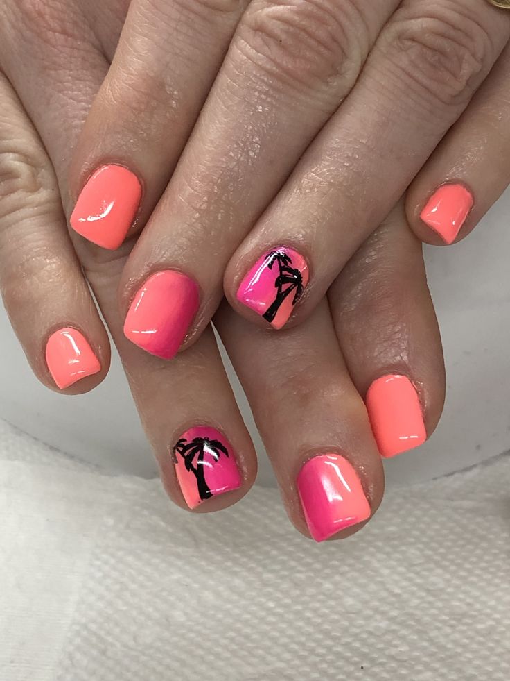 Tropical-Inspired Nail Design: Bright Pink and Coral with Palm Tree Accents.