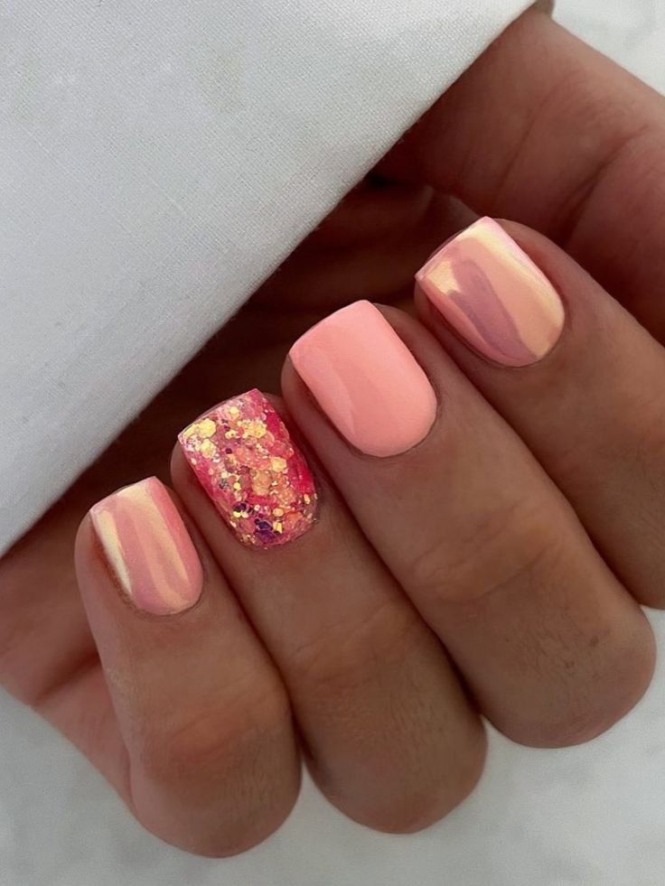 Vibrant Pink and Peach Nail Design with Glitter and Mixed Finishes.