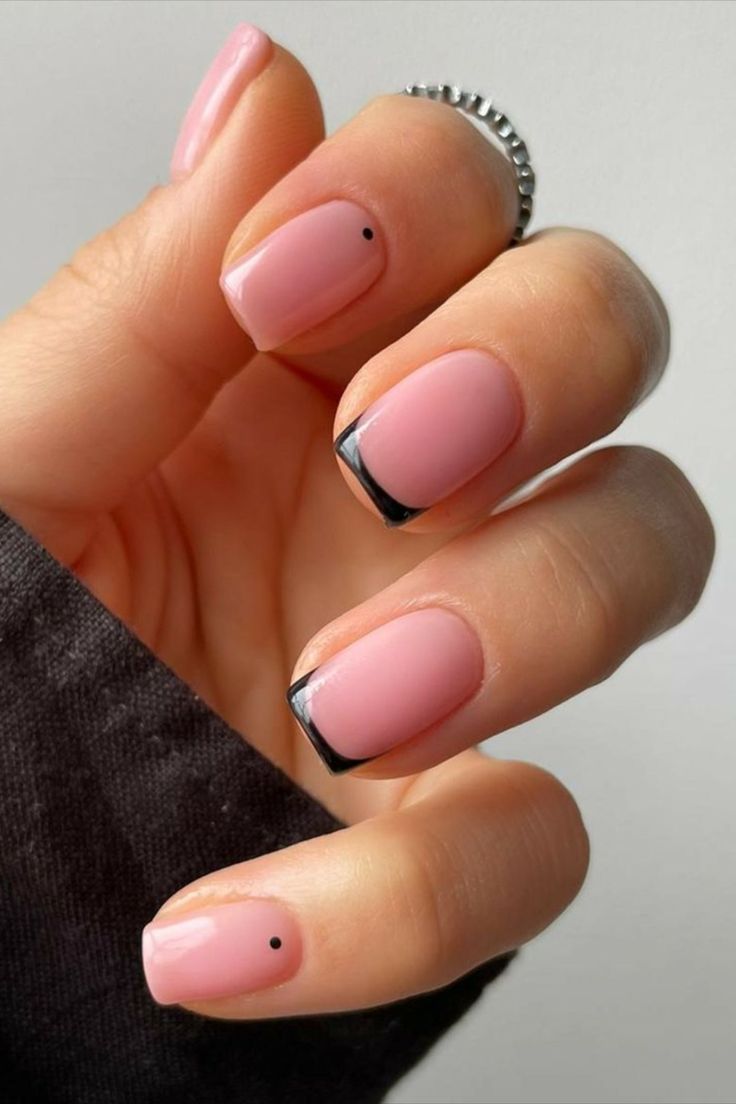 Chic Pink and Black Nail Design with Unique Dot Accents