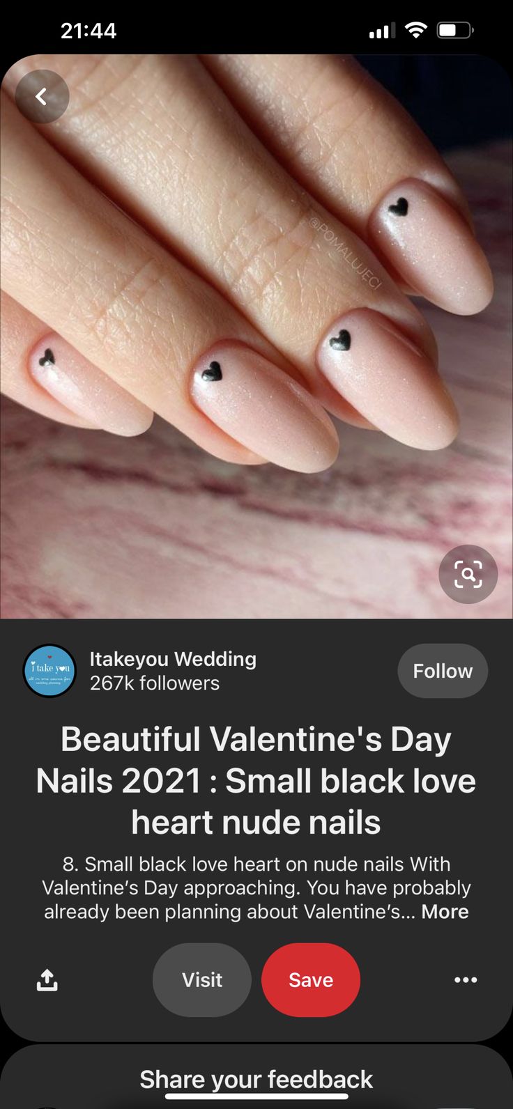 Elegant Nude Nail Design with Playful Black Heart Accents for Valentine's Day.