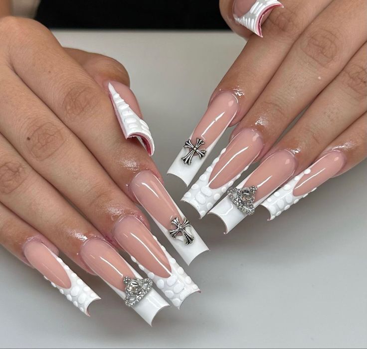 Elegant Long Acrylic Nails with Glossy White Tips and Silver Embellishments.