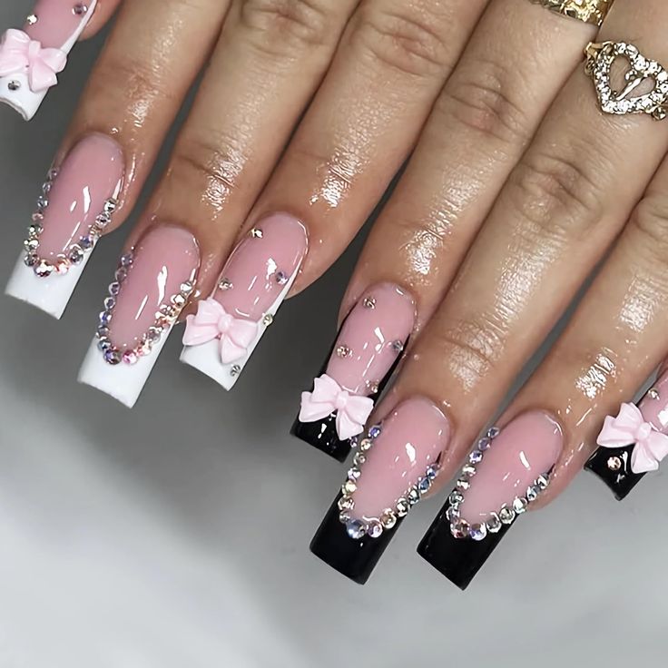 Chic Elegant Nail Design with Glossy Shades and Intricate Embellishments.