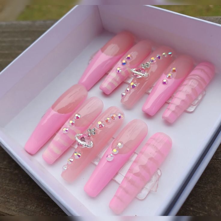 Chic Pink Nail Set: Glossy, Matte, and Textured Finishes with Sparkling Rhinestones.