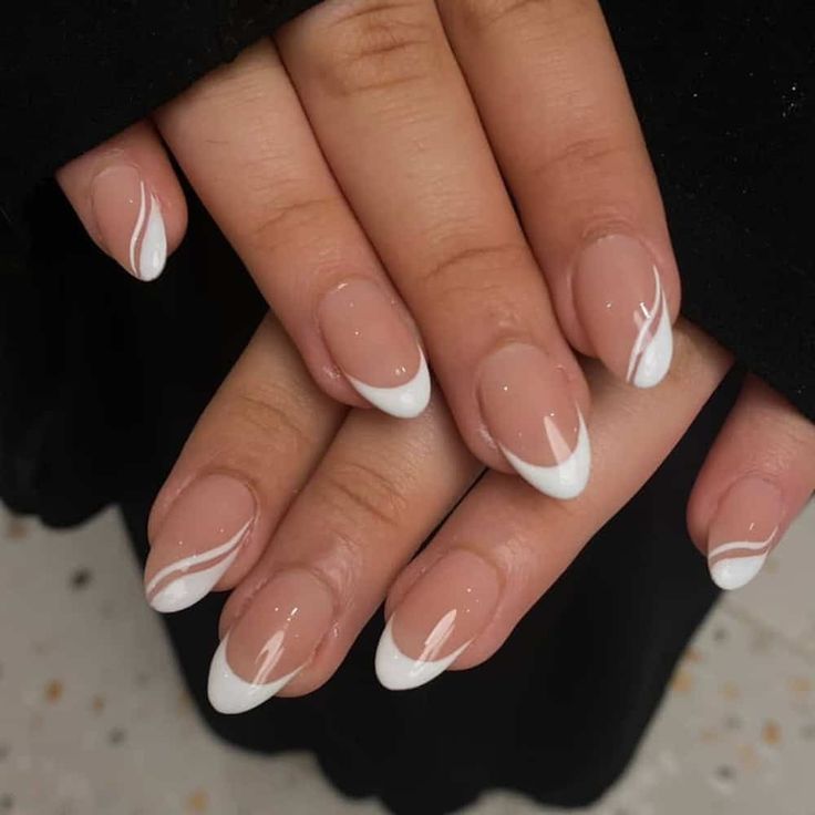 Elegant French Tips with White Swirls: A Sophisticated, Versatile Nail Art Design.