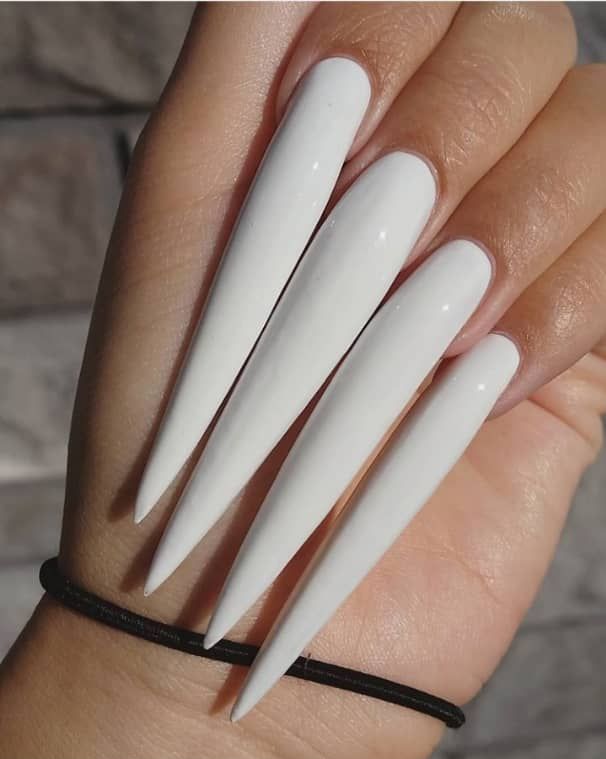 Elegant Glossy White Stiletto Nails: A Chic Statement of Modern Minimalism.