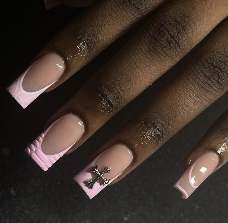 Sophisticated Soft Beige Nail Design with Textured Pink Accents and Metallic Charm.