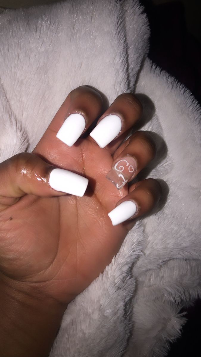 Chic White Acrylic Nails with Elegant Swirls: A Stylish Choice for Any Occasion.