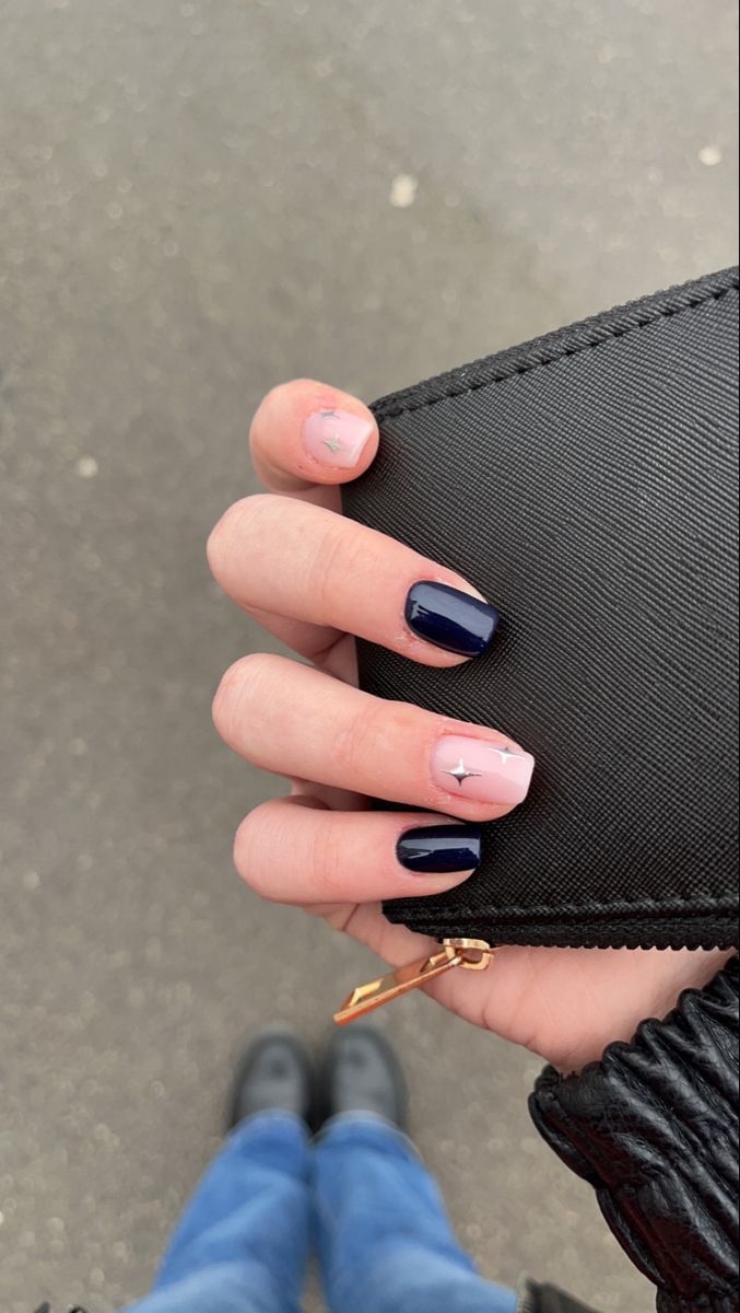 Chic Nail Design Blending Deep Navy and Soft Pink with Glossy Finishes and Star Accents.