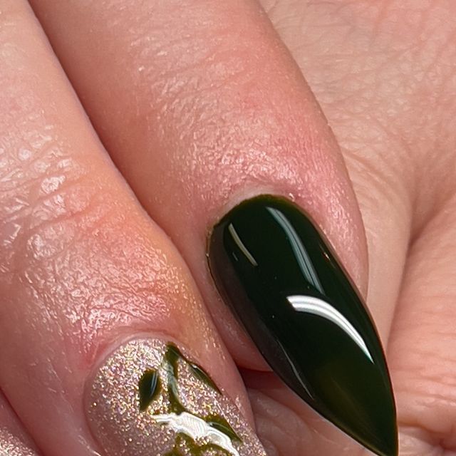 Elegant Dark Green and Glittery Floral Nail Design: A Modern Take on Classic Art.