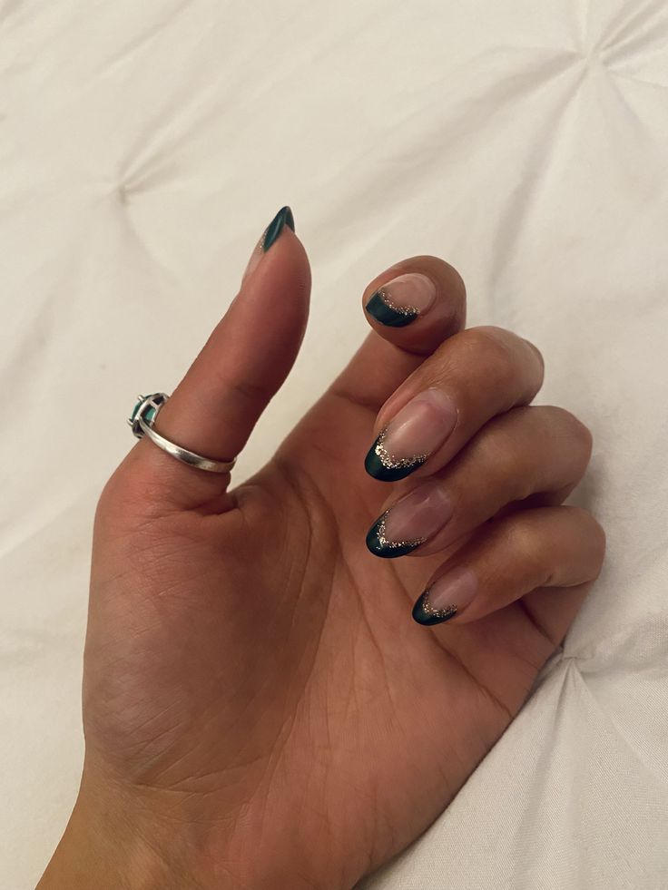 Chic French Tip Nail Design with Deep Green and Sparkling Silver Accents