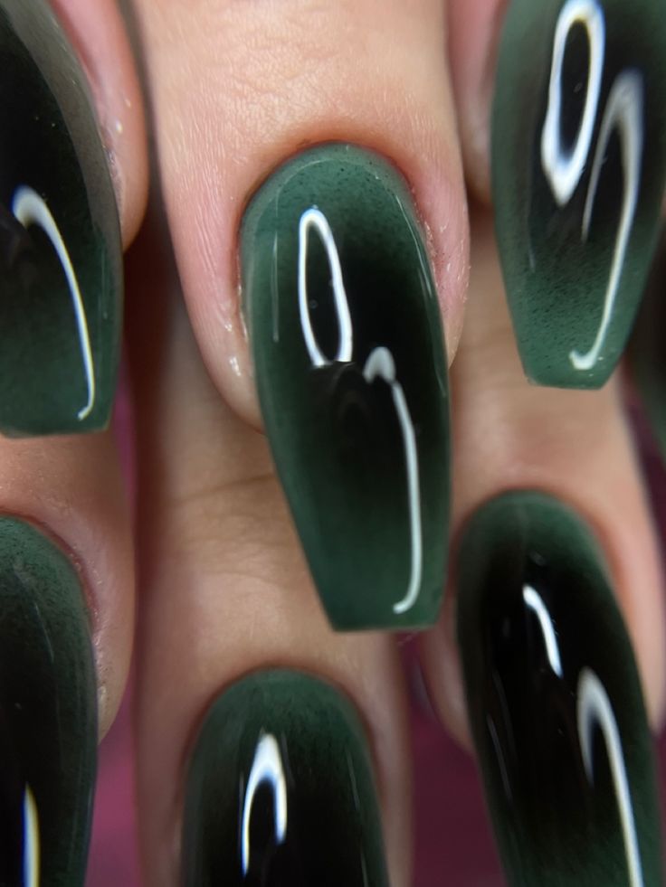 Elegant Deep Green Ombre Nail Design with Glossy Gradient Effect.