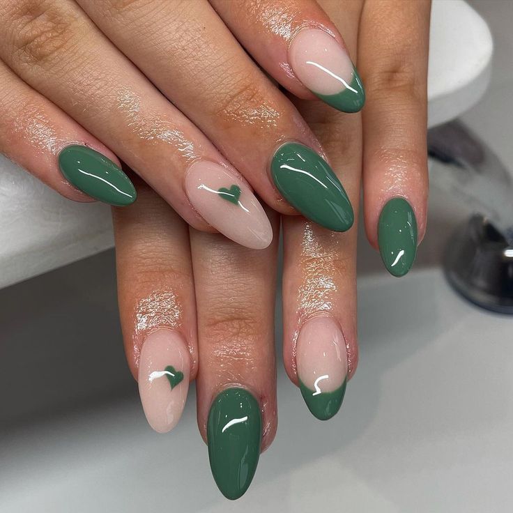 Charming Elegant Nail Design with Glossy Green, Soft Nude, Heart Motif, and Subtle Shimmer.