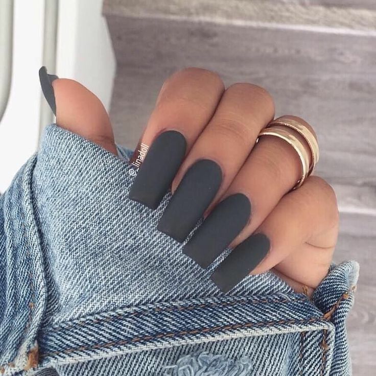 Chic Matte Gray Nails: Edgy Long Square Design for a Modern Look with Denim and Stacked Rings.