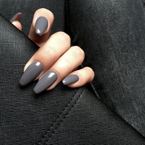 Chic Long Tapered Gray Manicure with Glossy Finish on Textured Black Background