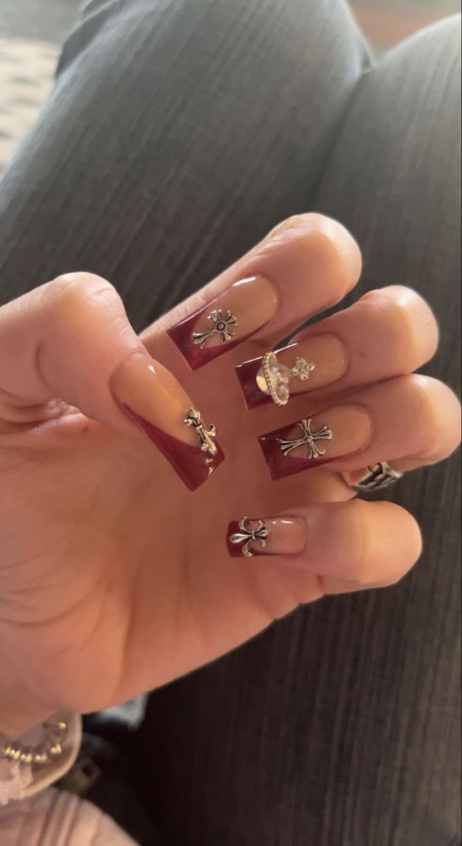 Chic Deep Burgundy and Nude Nail Design with Elegant Metallic Accents