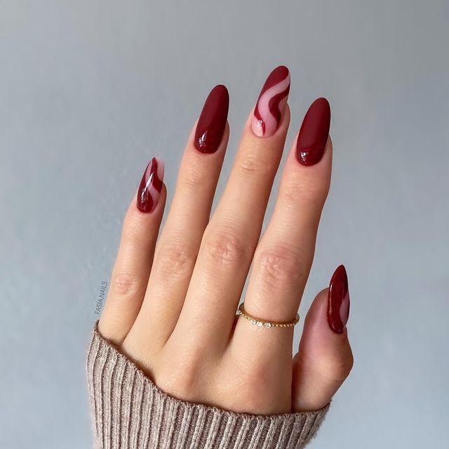 Sophisticated Almond-Shaped Burgundy Nails with Elegant Pink Swirls for a Glamorous Touch.