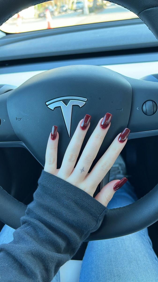 Sophisticated Glossy Burgundy Nails: A Chic Touch of Glamour for Any Outfit.