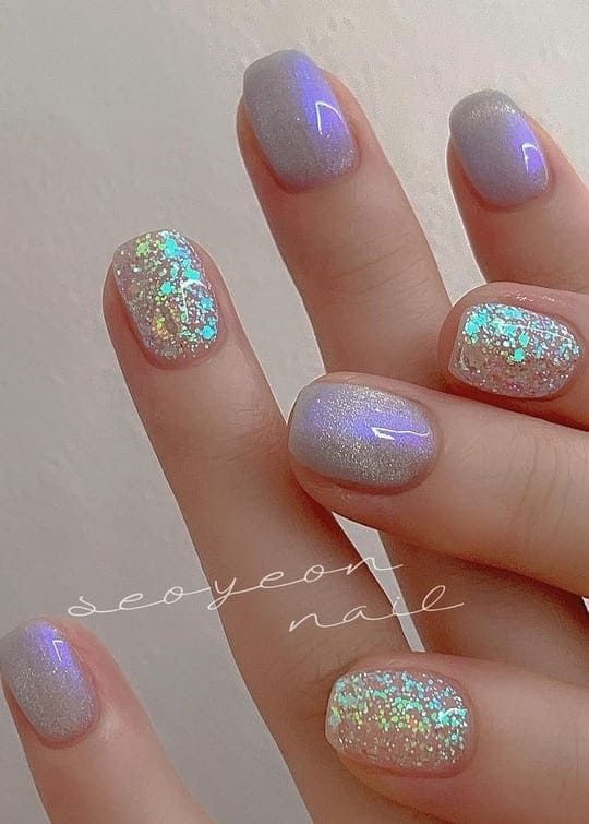 Elegant Ombre Nails: Soft Lavender to Shimmering Silver with Iridescent Glitter Accents