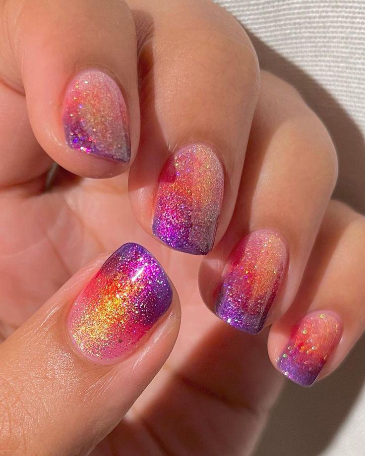 Vibrant Gradient Nail Design with Glittery Ombre Effect