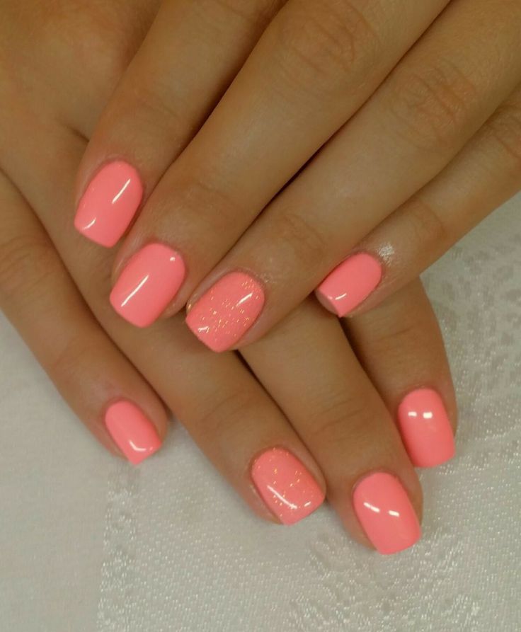 Chic Glossy Coral Nail Design with Pastel Shades and Shimmer Accent.