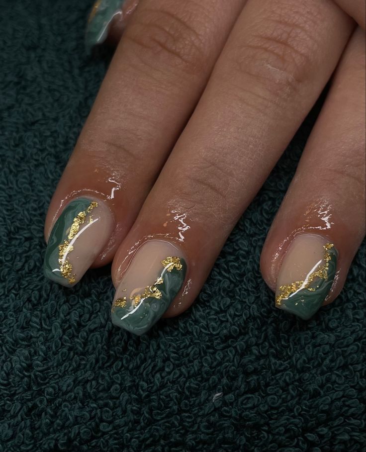 Sophisticated Abstract Green and Gold Nail Design with Glossy and Matte Finishes.