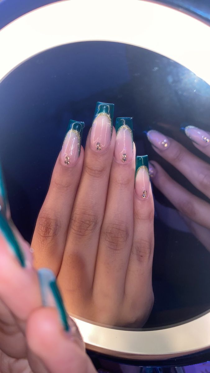 Sophisticated Green Ombre Nail Design with Gold Studs on Long Square Tips.