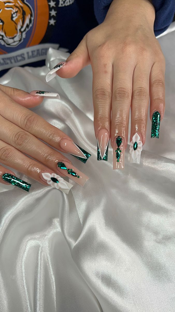 Bold Elegant Nail Design: Glossy and Matte Finishes with Emerald Green Glitter and Floral Accents