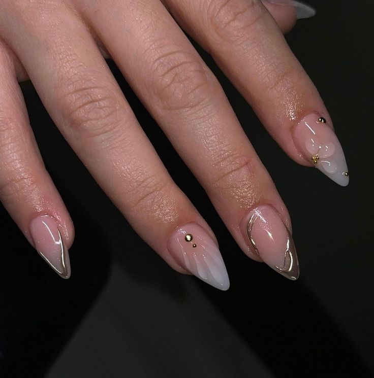 Chic Soft Pink and Nude Gradient Nail Design with Gold Accents and Studs.