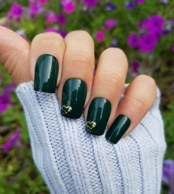 Sophisticated Elegant Green Nail Design with Gold Heart Accents