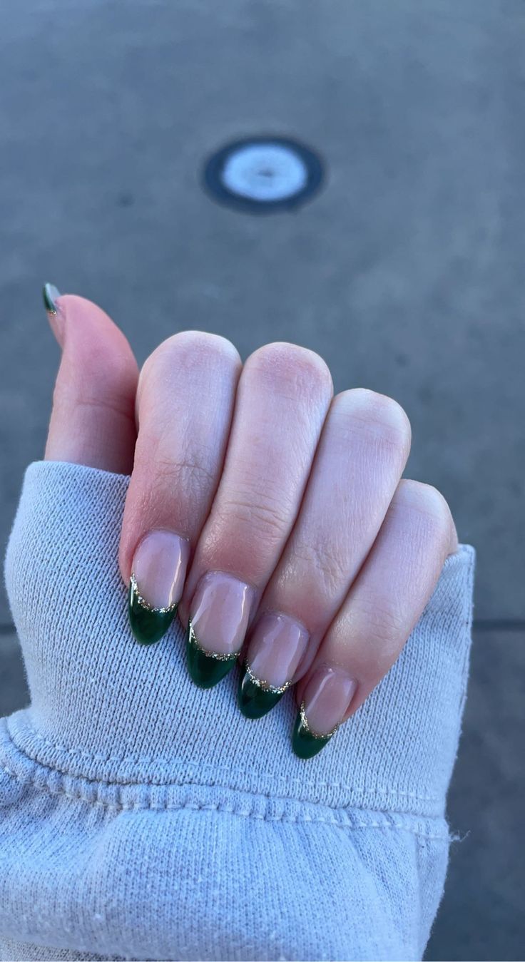 Elegant Green French Tips with Golden Accents: A Sophisticated and Bold Nail Style for Every Occasion.