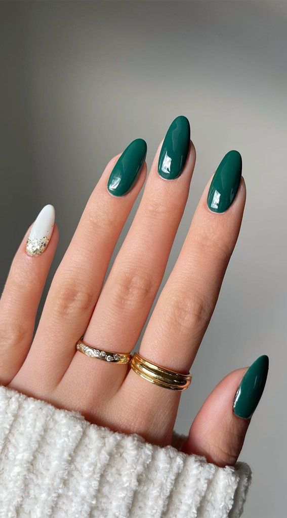 Chic Deep Green and White Nail Design with Gold Glitter Accents