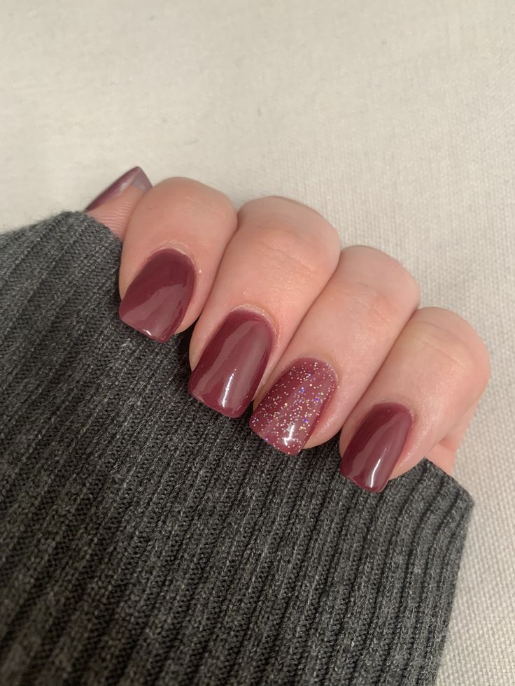 Chic Burgundy Nail Design with Sparkly Accent: Perfect for Any Occasion.