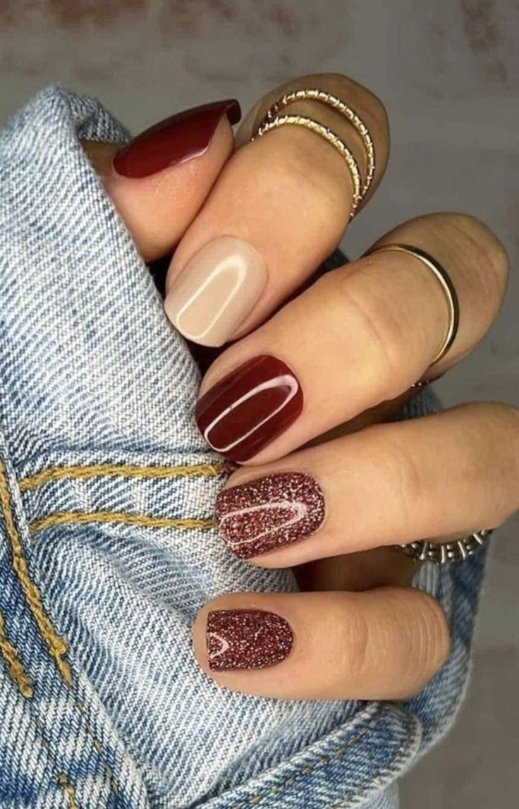 Elegant Nail Design: Deep Burgundy and Nude Blend with Matte and Sparkly Finishes.