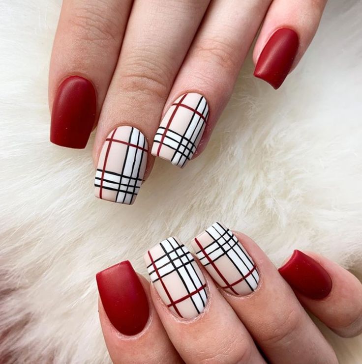 Chic Geometric Nail Design: Bold Colors Against a Striking White Base.