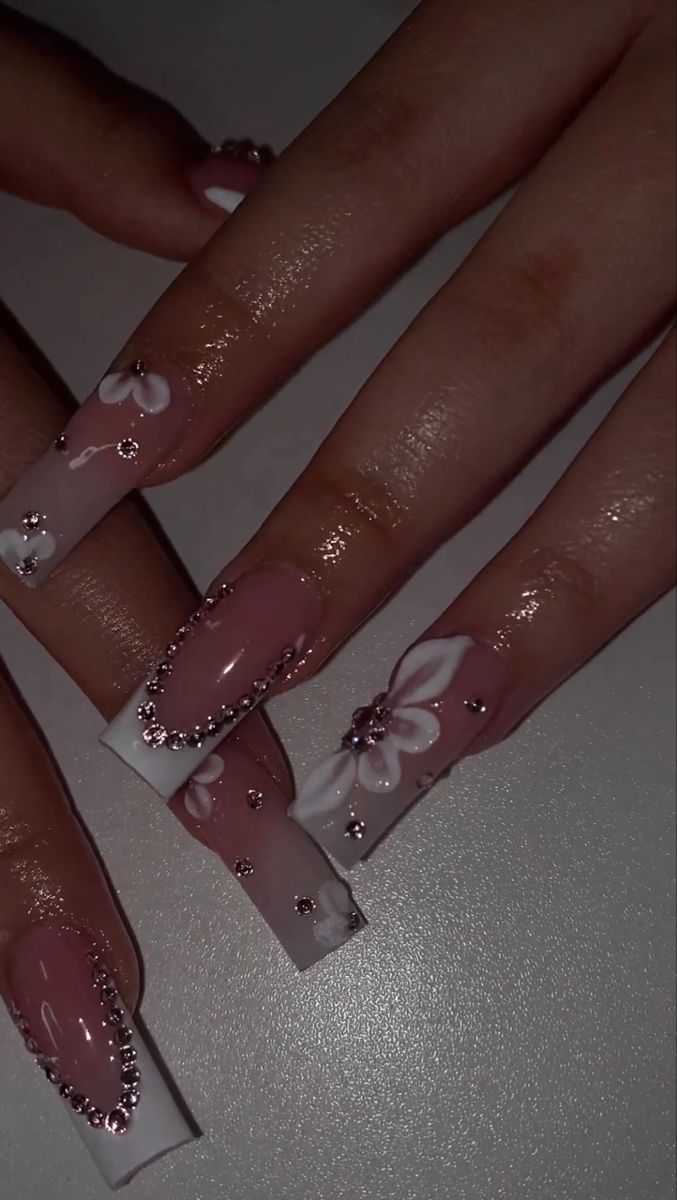 Elegant Floral Nail Design: Long Square Tips with Soft Pink, Classic White, and Rhinestone Accents for a Romantic Look.