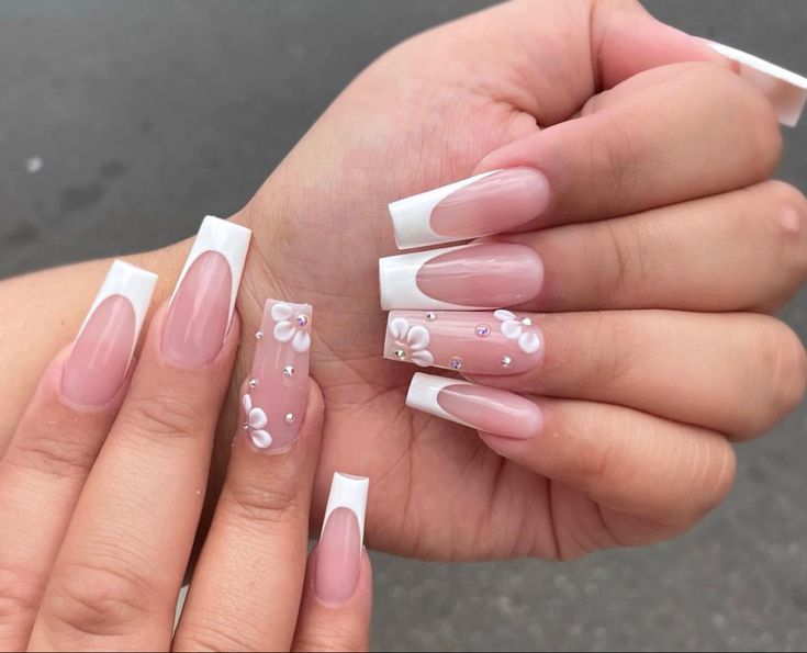 Chic Sophistication: Elegant French Tip Nails with Soft Pink and Floral Accents