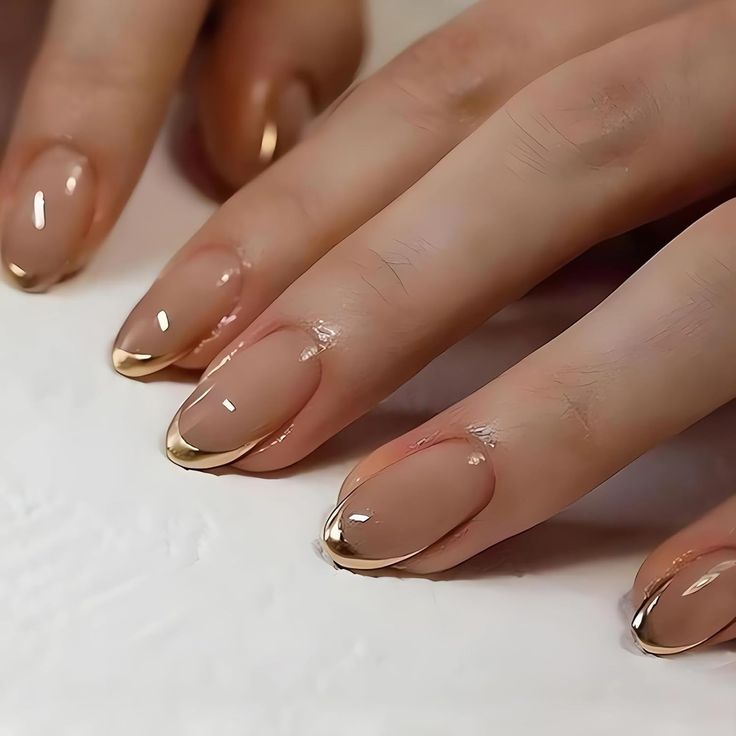 Chic Elegant Nude Nails with Glamorous Golden Tips.