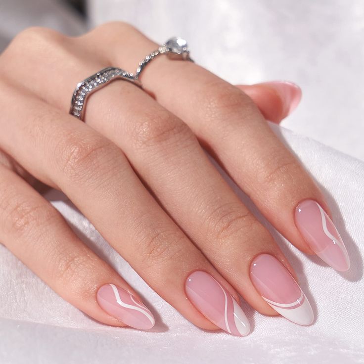 Chic Soft Pink Nail Design with Elegant White Accents.