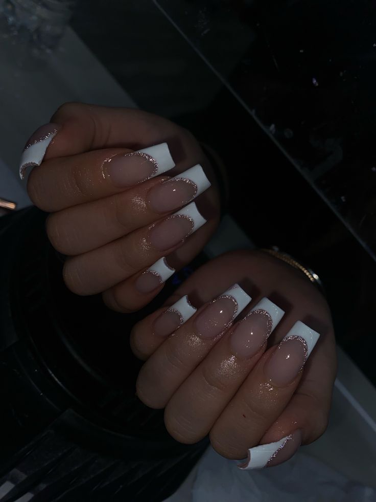 Chic Nude and White Tip Nail Design with Glitter Accents for Any Occasion.