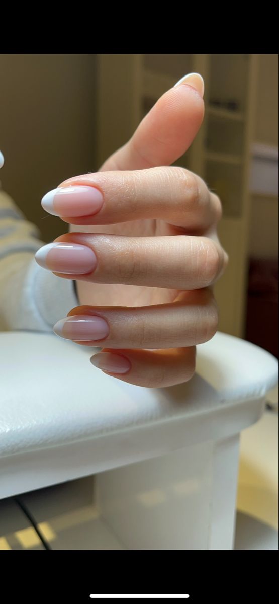 Sophisticated Soft Pink and Classic White French Tip Nail Design