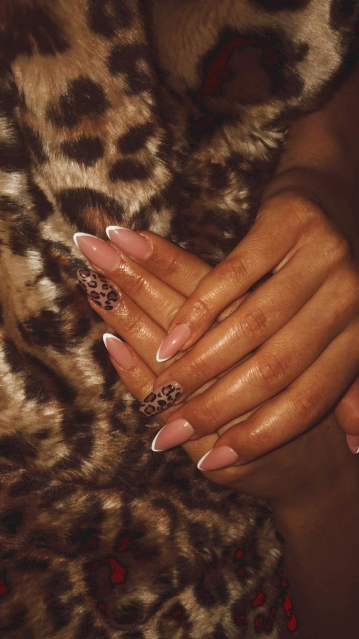 Chic Almond-Shaped Nails: Blending Classic Elegance with Bold Leopard Accents.