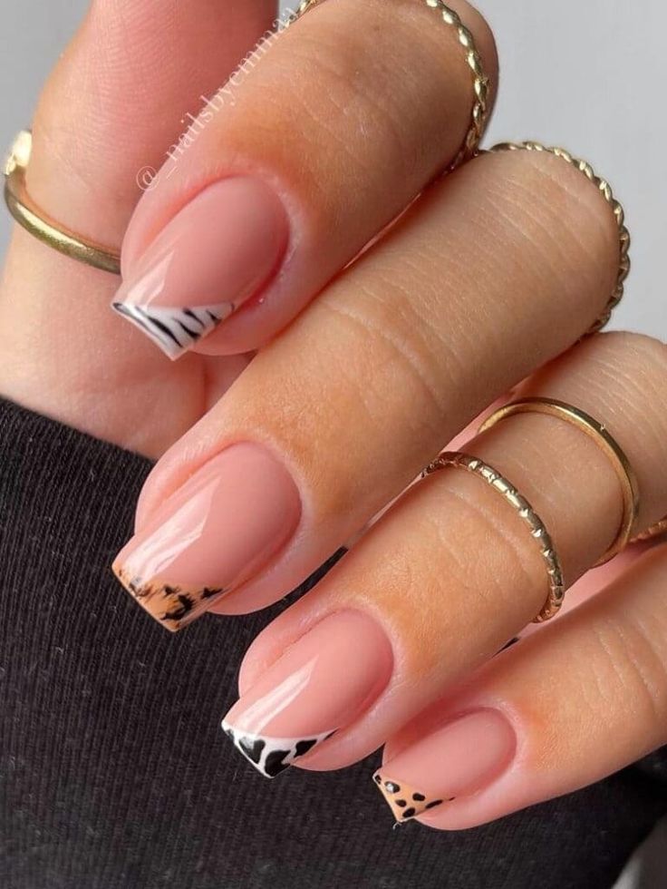 Chic Nude Nail Design with Patterned Tips and Gold Accents