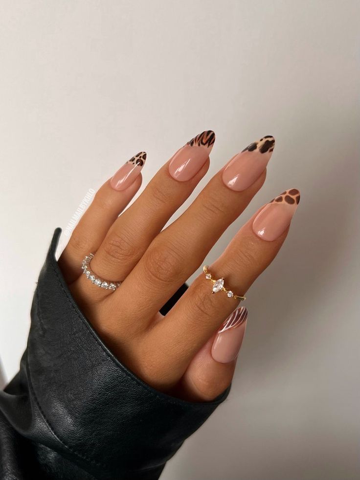 Chic Leopard-Print Tips on Nude Base: A Bold and Elegant Manicure.