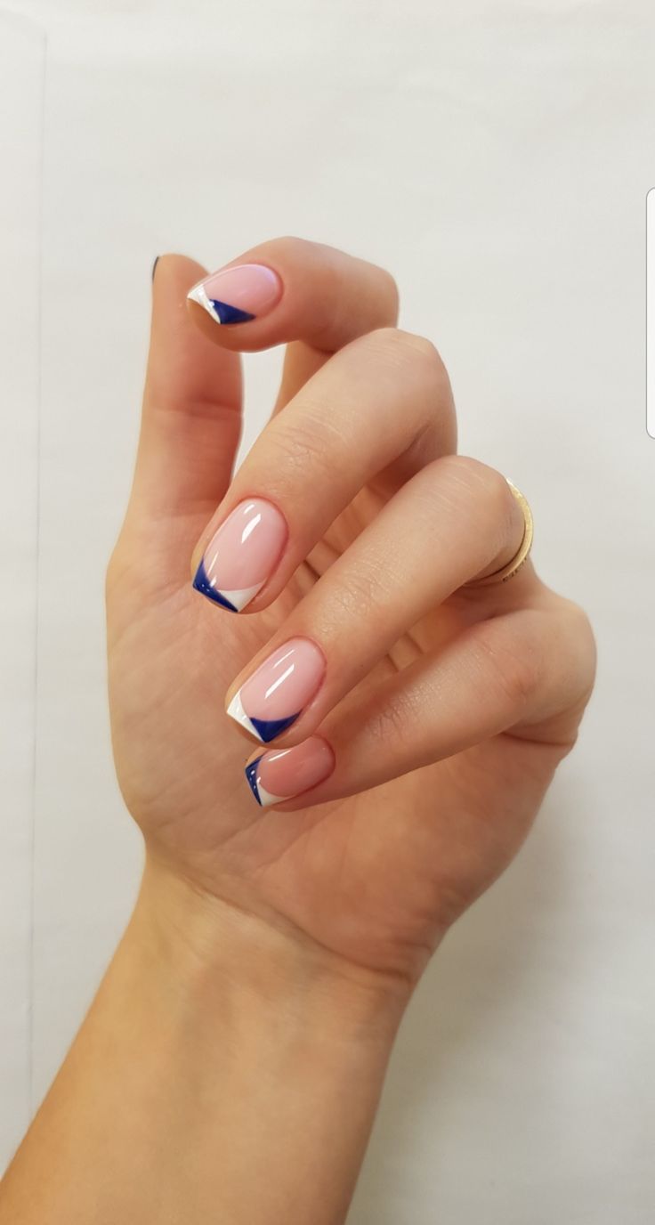 Modern French Tip Nail Design with Soft Pink Base and Navy Blue Accents.