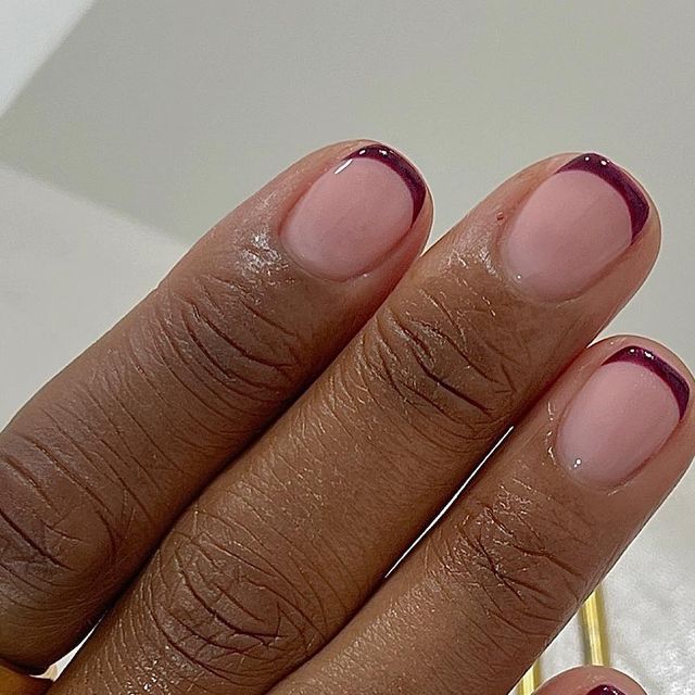 Chic Nude and Glossy Burgundy Nail Design: Elegant Sophistication for Any Occasion.