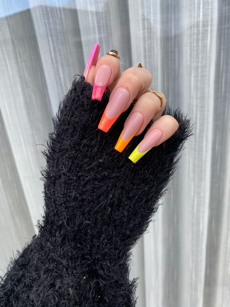 Playful Colorful Ombre Nail Design with Soft Nude Base and Vibrant Tips.