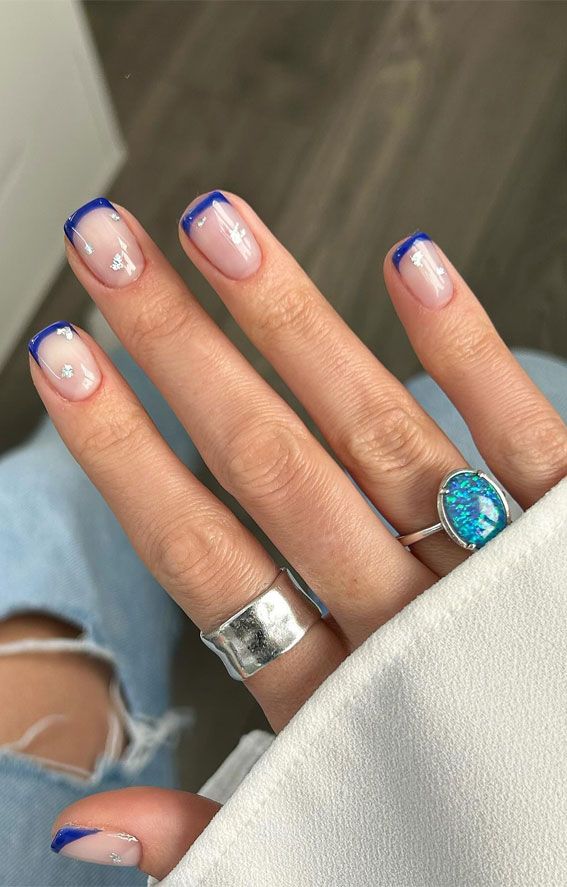 Chic French Tip Nail Design with Bold Blue Outline and Elegant Silver Accents