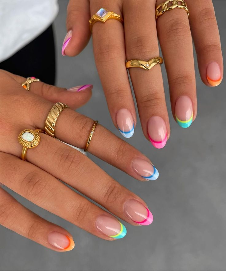 Playful Gradient French Tip Nails with Elegant Gold Accents.