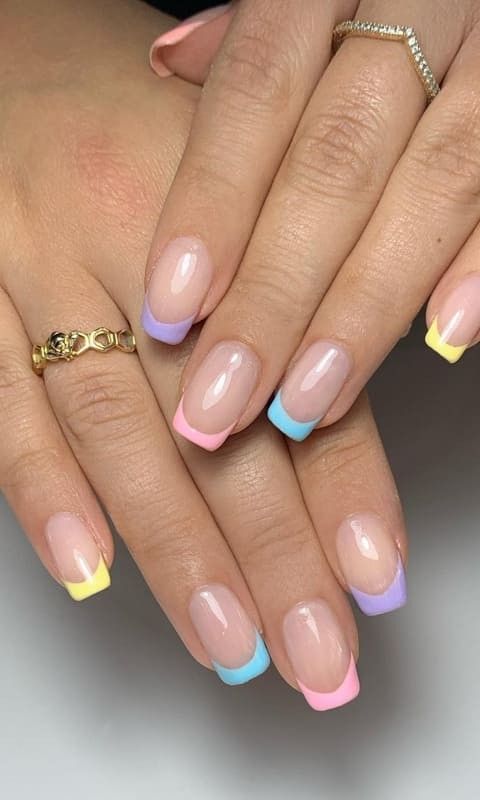 Playful Sophistication: Colorful Pastel French Tip Nail Design.