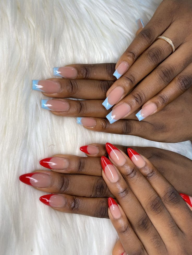 Vibrant and Subtle Nail Design: Bold Almond-Shaped Reds Meet Soft Blue Accents.